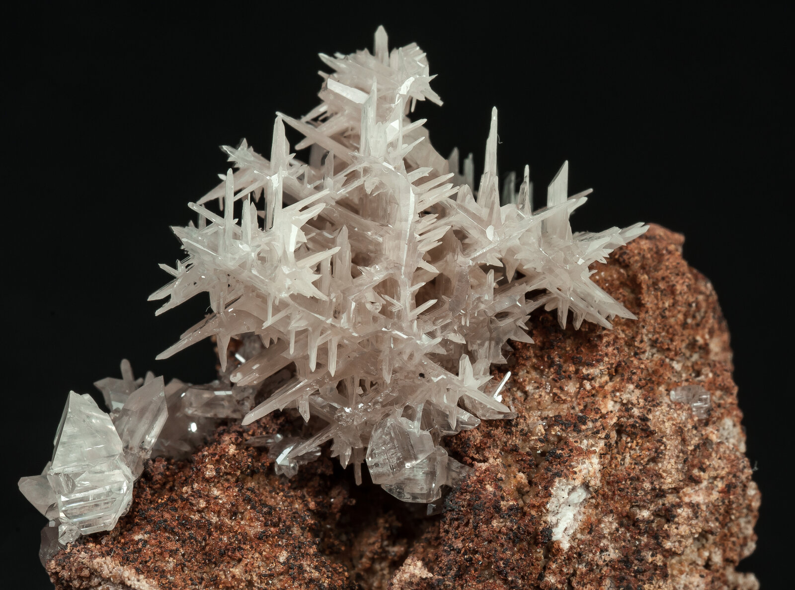 Cerussite crystal growth on a mineral matrix